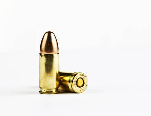 Fellow passenger takes a bullet, man charged
