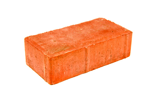 Assault charges for alleged brick thrower