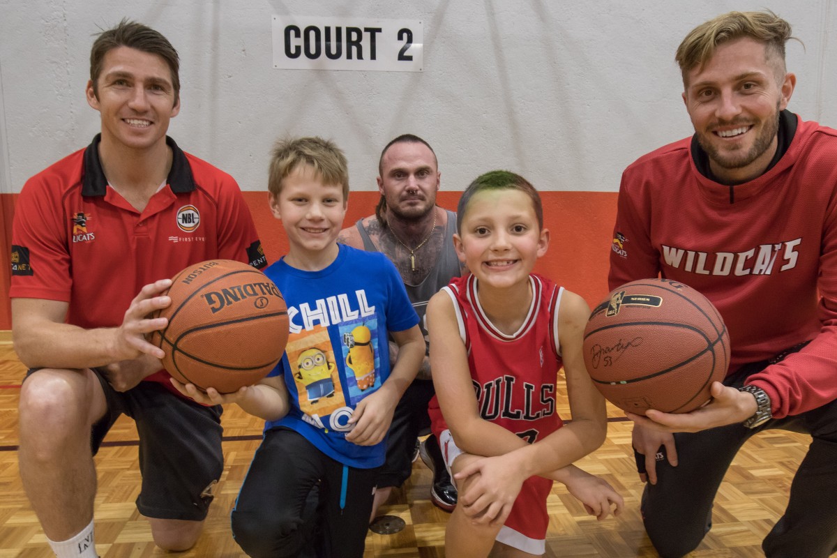 Wildcats visit delights kids