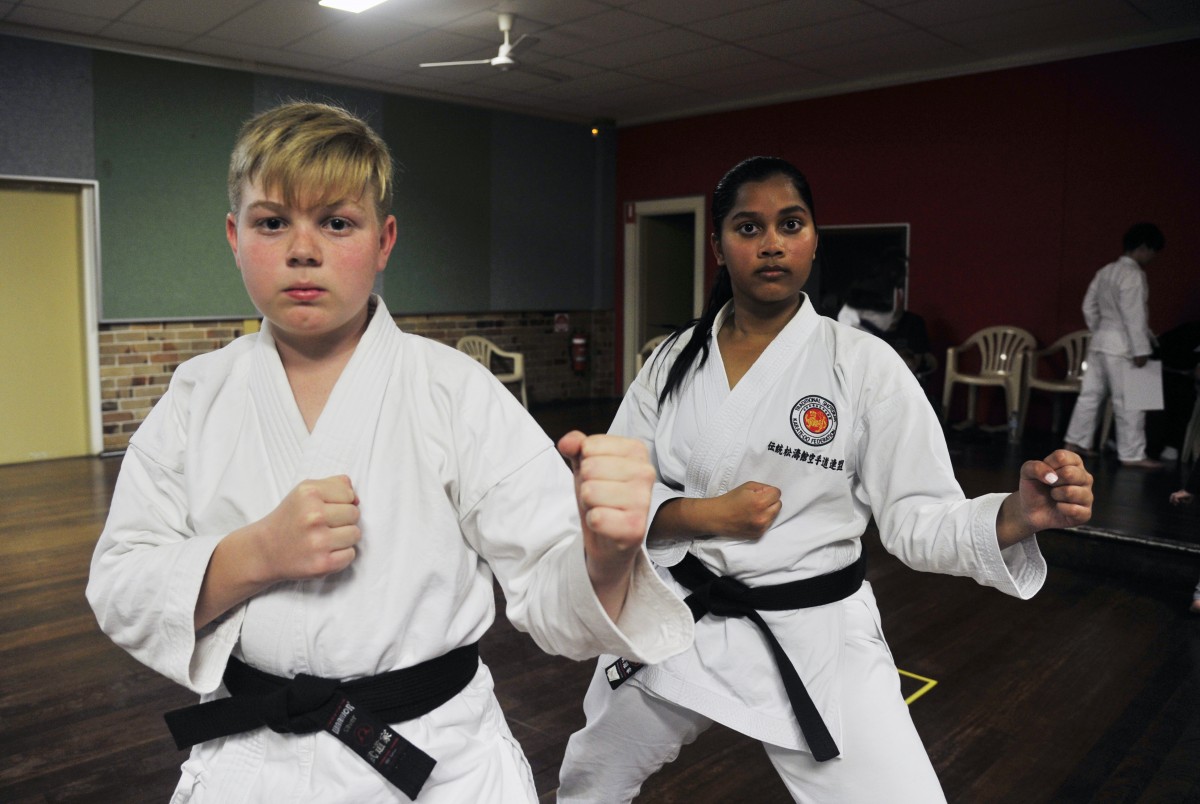 Young karate members put in the hard yards to earn their black belts