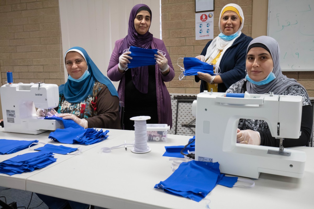 Volunteers pitch in to make face masks