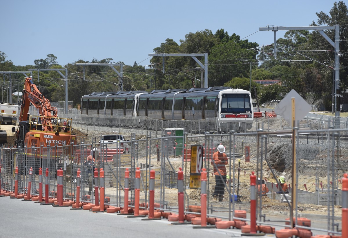 Trainlines down at night as Denny Ave works progress