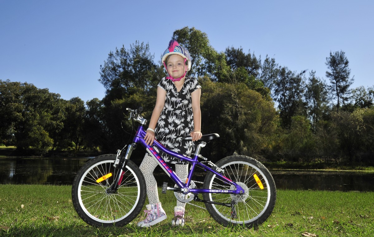 Seven-year-old rides for other children with cancer
